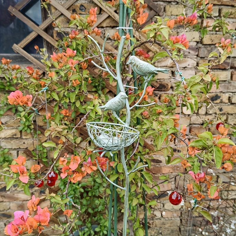 An exquisite faux tree-shaped garden stake with a beautifully crafted simulated bird's nest, perfect for farmhouse gardens and villa courtyard landscaping decor