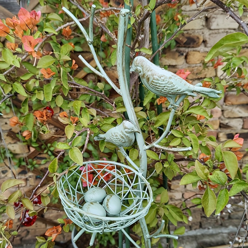 An exquisite faux tree-shaped garden stake with a beautifully crafted simulated bird's nest, perfect for farmhouse gardens and villa courtyard landscaping decor